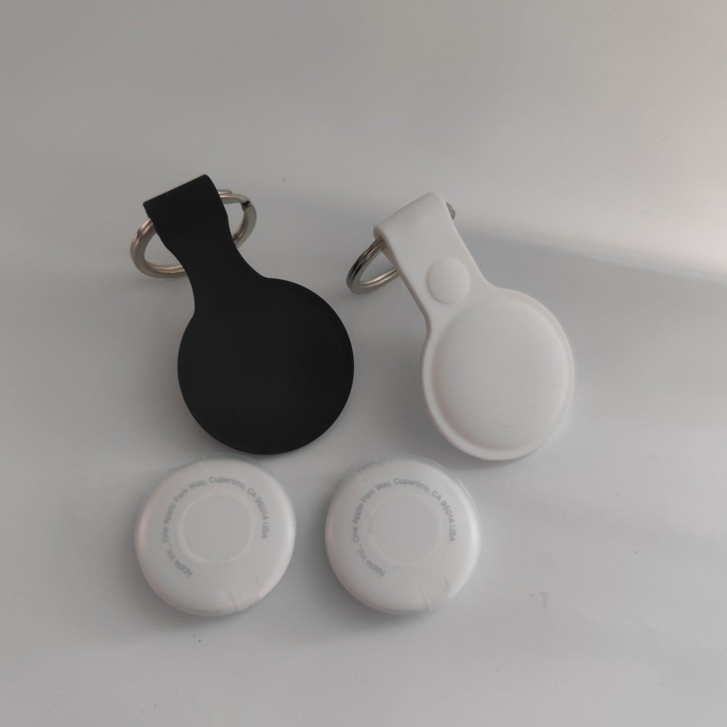 Set 2 Apple NFC AirTag Tracker with 2 Case Pendant Protective Case Keyring Silicone Black and White